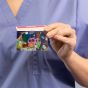 healthcare nurse holding pediatric card