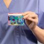 Healthcare worker holding pediatric sea card with badge buddy