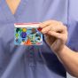 Healthcare nurse holding a sky design pediatric card